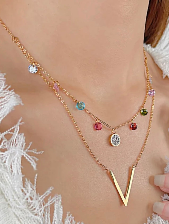 ASSA l collier doré et zircon multicolore