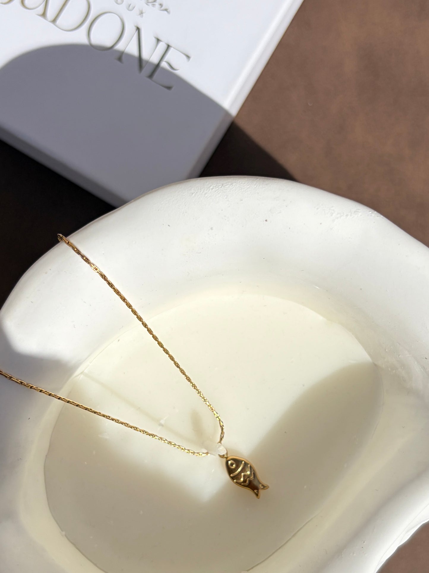 Huna l collier doré poisson 🐟